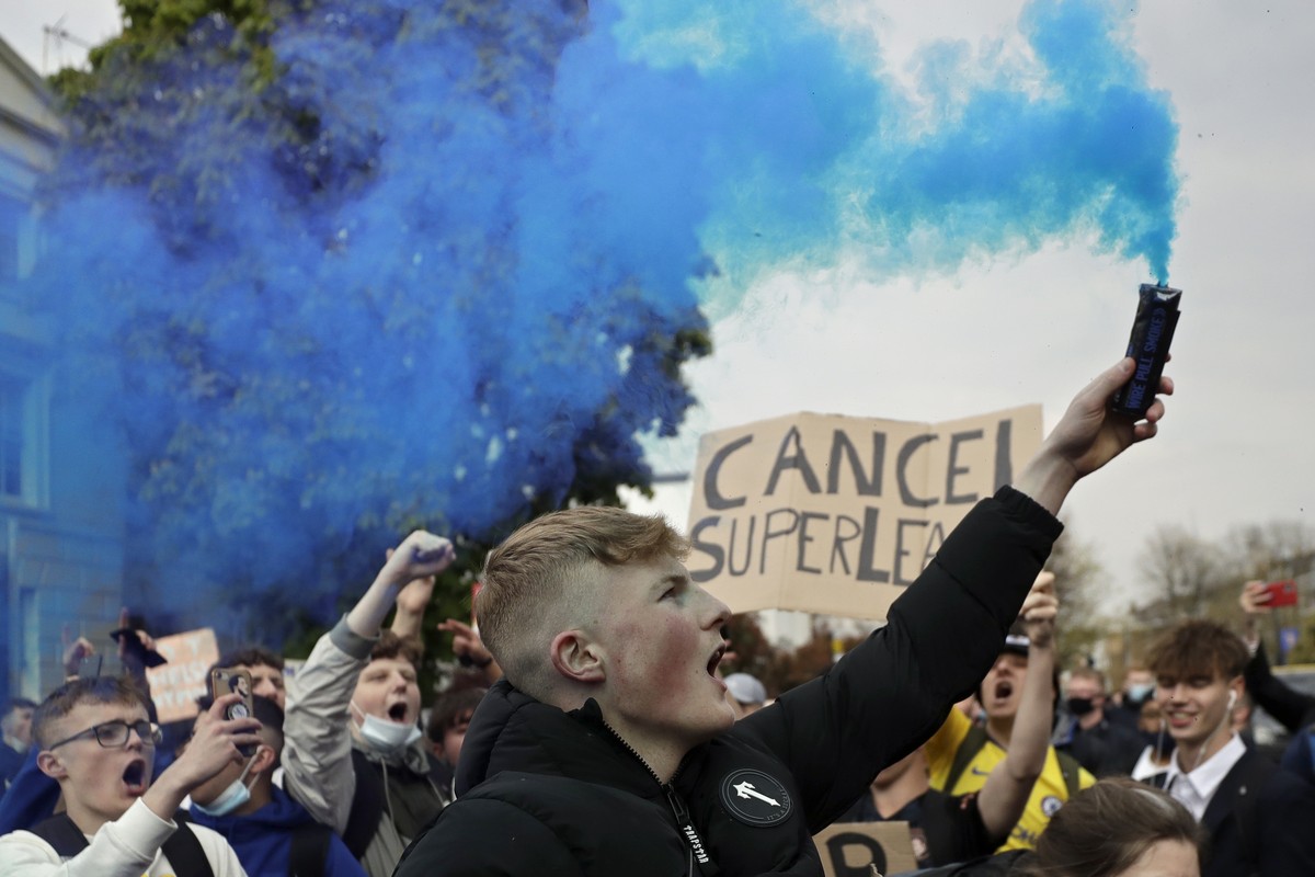FILE - In this Tuesday, April 20, 2021 file photo, Chelsea fans protest outside Stamford Bridge stadium in London, against Chelsea's decision to be included amongst the clubs attempting to form a ...