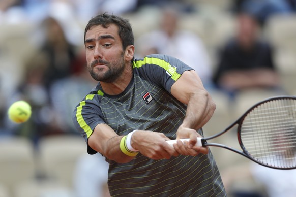 Croatia&#039;s Marin Cilic plays a shot against Bulgaria&#039;s Grigor Dimitrov during their second round match of the French Open tennis tournament at the Roland Garros stadium in Paris, Wednesday, M ...