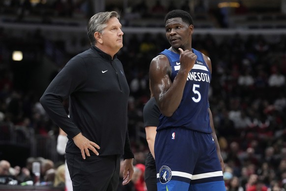 Minnesota Timberwolves guard Anthony Edwards, right, talks with head coach Chris Finch during the first half of an NBA preseason basketball game against the Chicago Bulls in Chicago, Thursday, Oct. 19 ...