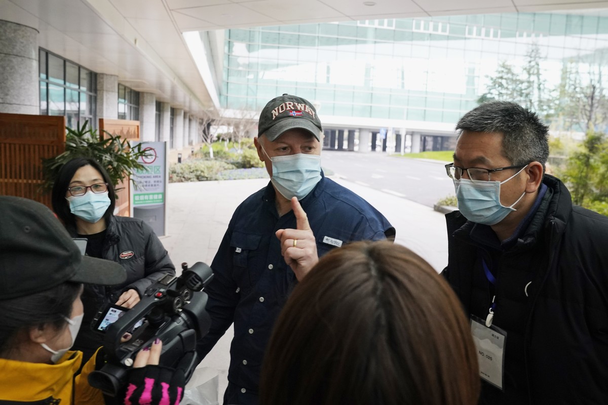 Peter Daszak of the World Health Organization team speaks to journalists before entering the VIP terminal of the airport to leave at the end of the WHO mission in Wuhan in central China's Hubei p ...