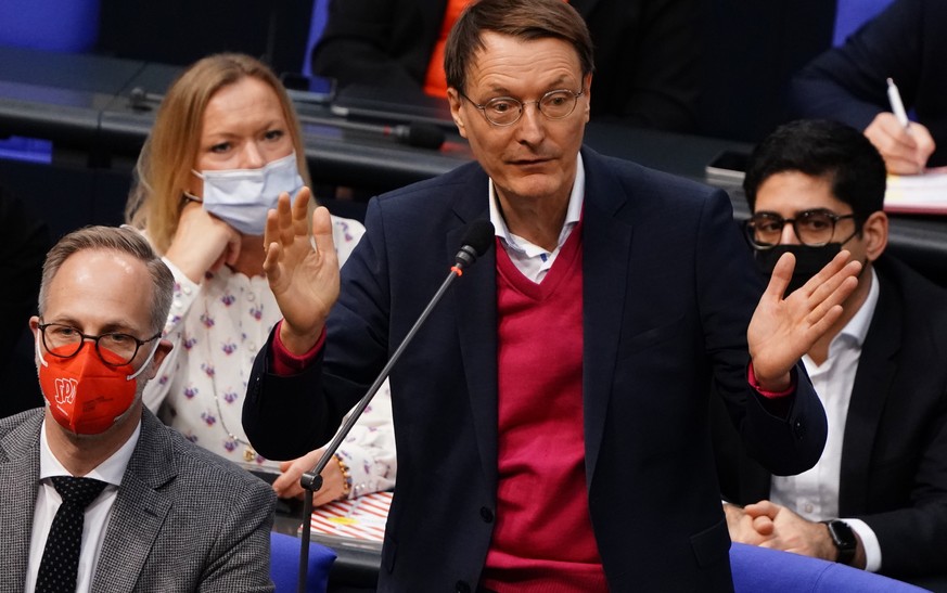 epa09588842 Social Democrats health expert and epidemiologist Karl Lauterbach gestures as he speaks during a session of the German parliament Bundestag in Berlin, Germany, 18 November 2021. The German ...