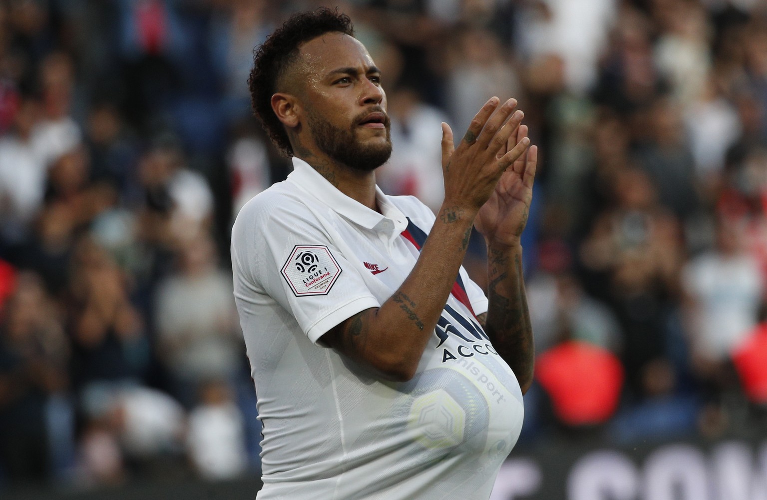 PSG&#039;s Neymar celebrates his goal during the French League One soccer match between Paris Saint Germain and Strasbourg at the Parc des Princes Stadium in Paris, France, Saturday Sept.14, 2019. (AP ...