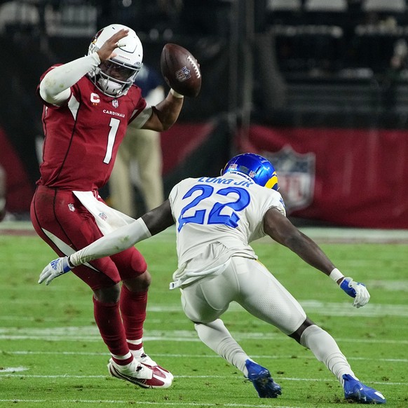 Arizona Cardinals quarterback Kyler Murray (1) tries to elude Los Angeles Rams defensive back David Long (22) during the second half of an NFL football game Monday, Dec. 13, 2021, in Glendale, Ariz. ( ...