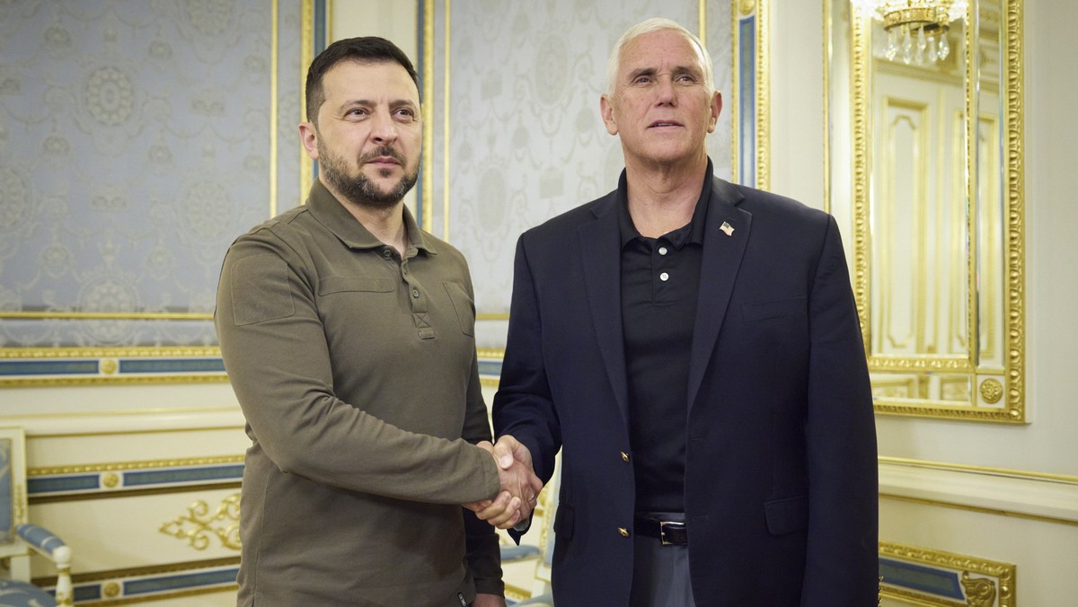 In this photo provided by the Ukrainian Presidential Press Office, Ukrainian President Volodymyr Zelenskyy, left, and former US Vice President Mike Pence pose for photo during their meeting in Kyiv, U ...