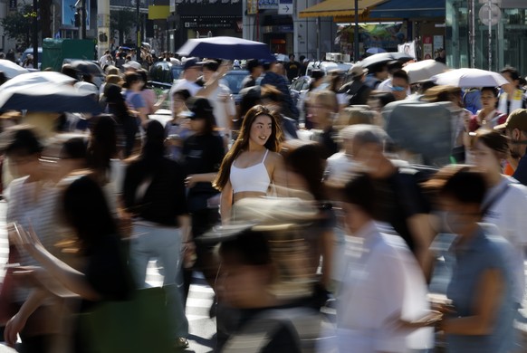 epa12182831 Tourists and commuters walk through Shibuya Crossing in Tokyo, Japan, 18 June 2025. According to data released by the JNTO (Japan National Tourism Organization) on 18 June 2025, the number ...