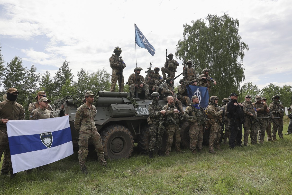 epa10650538 Members of the 'Russian Volunteer Corps' and 'Freedom of Russia Legion' hold a meeting with the media not far from the Ukraine-Russia border in Kharkiv's area, nor ...