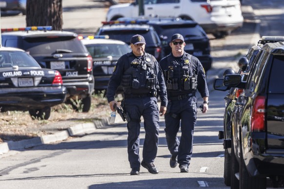epa10212503 Law enforcement work at the scene of a shooting at a complex which houses several schools including Sojourner Truth Independent Study, in East Oakland, California, USA, 28 September 2022.  ...