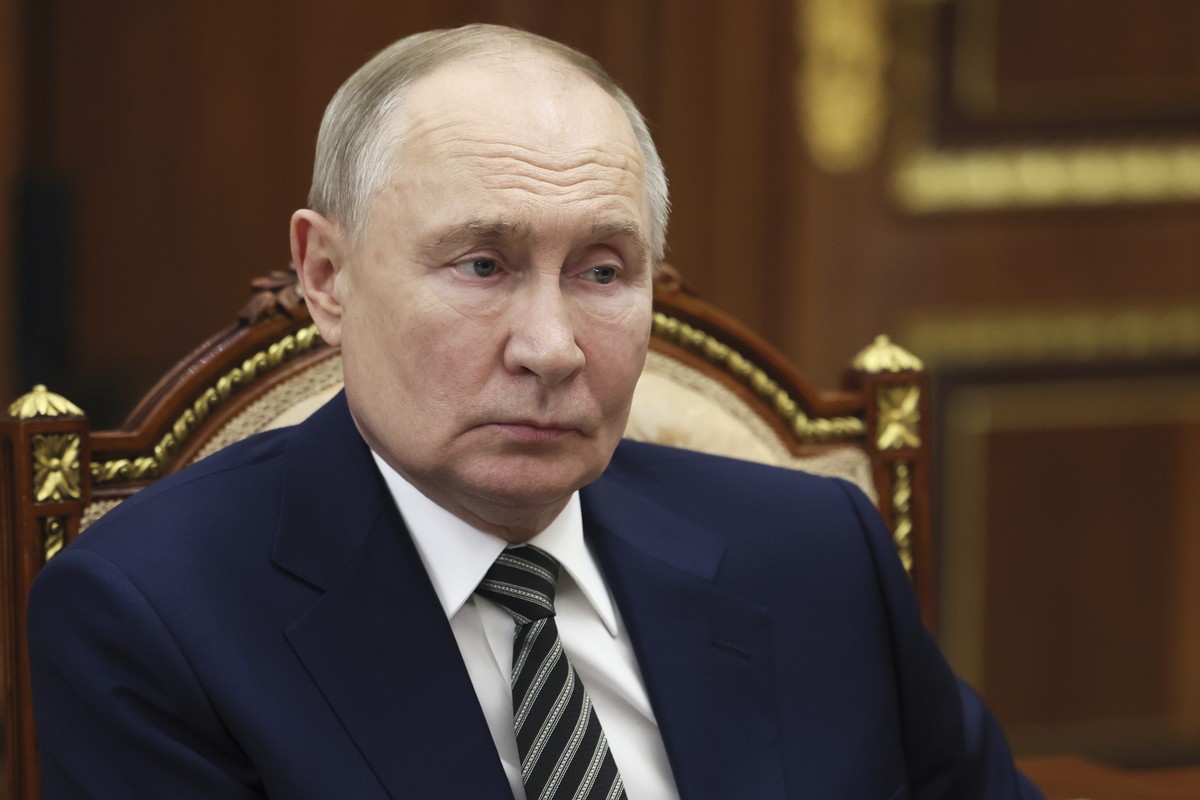 Russian President Vladimir Putin speaks with the governor of Arkhangelsk region Alexander Tsybulsky during their meeting at the Kremlin in Moscow, Russia, Tuesday, March 11, 2025. (Mikhail Metzel, Spu ...