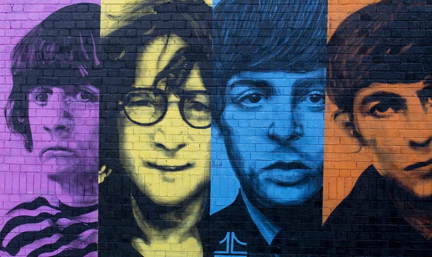 epa08743611 A mural of the Beatles is painted onto a wall in the Baltic Triangle area Liverpool, Britain, 14 October 2020. EPA/PETER POWELL