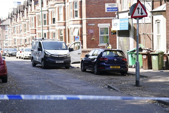 A white van is seen behind a police cordon on the corner of Maples Street and Bentinck Road on the corner of Maples Street and Bentinck Road after three people were killed in Nottingham city center, E ...