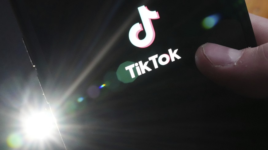The TikTok startup page is displayed on an iPhone in Ottawa, Ontario, Monday, Feb. 27, 2023. The federal government is banning TikTok from its mobile devices just days after federal and provincial pri ...