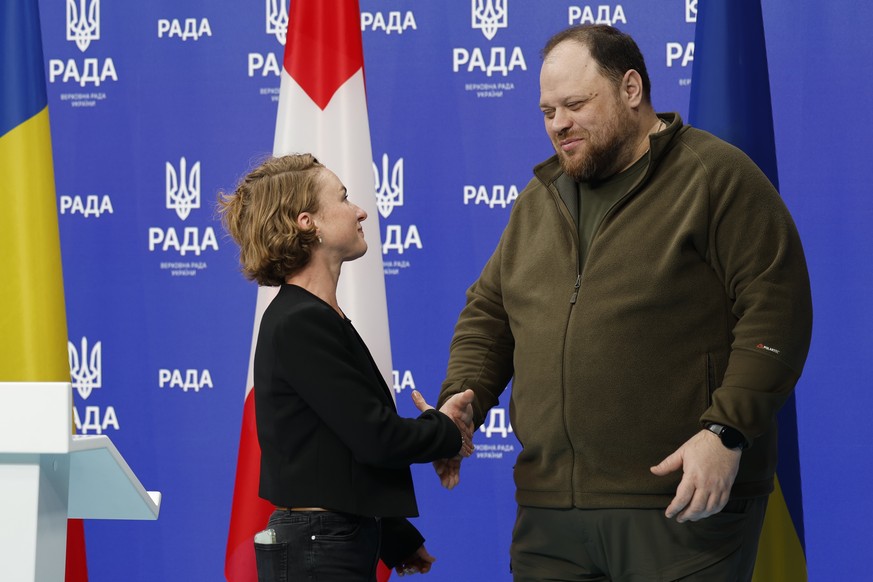 Ruslan Stefanchuk, President of the Ukrainian Parliament, and Irene Kaelin, President of the Swiss National Assembly, shake hands during a press conference in the parliament building in Kiev, Ukraine, ...