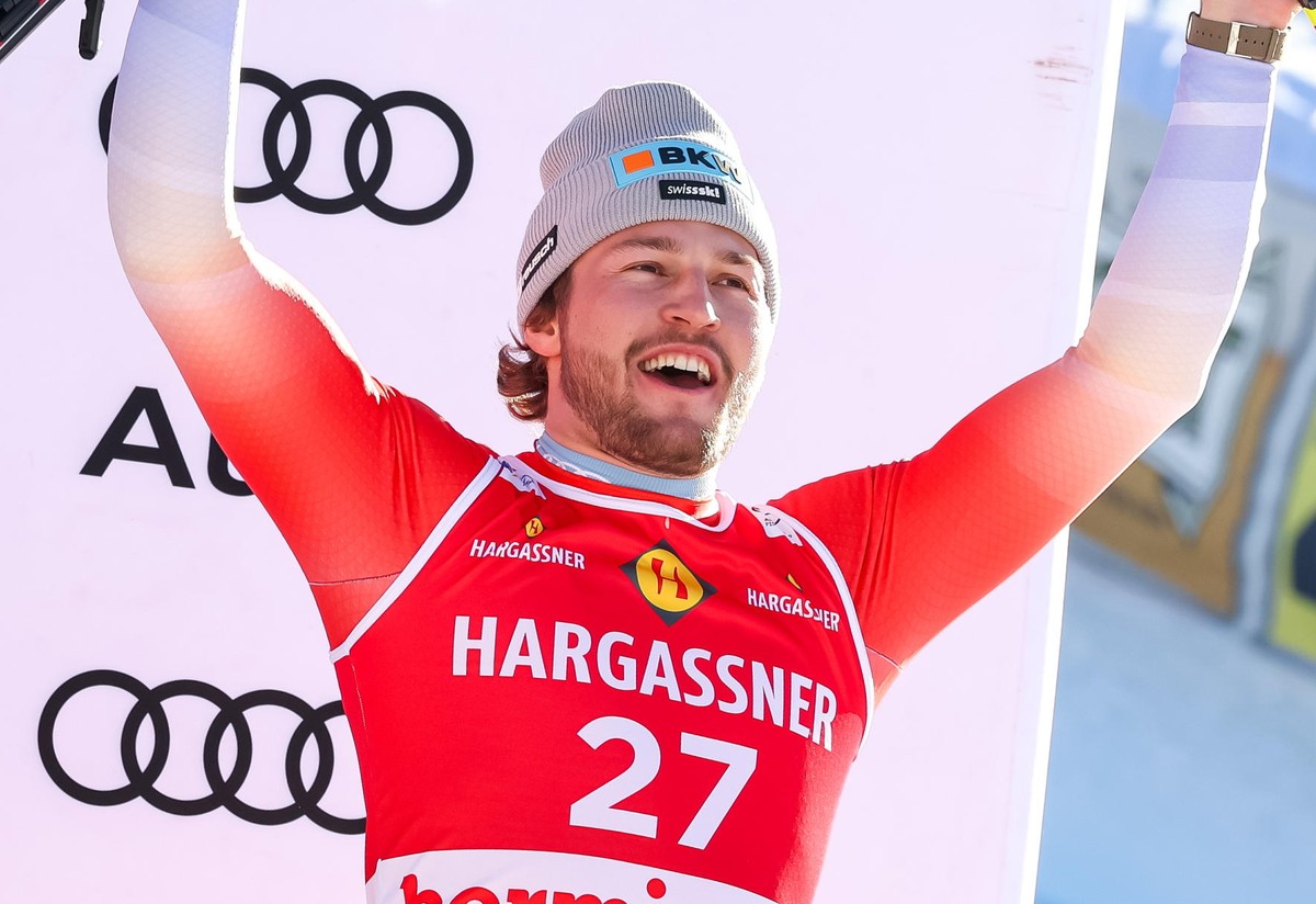 epa11797423 Third placed Alexis Monney of Switzerland celebrates on the podium after the Men's Super G race at the FIS Alpine Skiing World Cup stage in Bormio, Italy, 29 December 2024. EPA/SOLERO ...