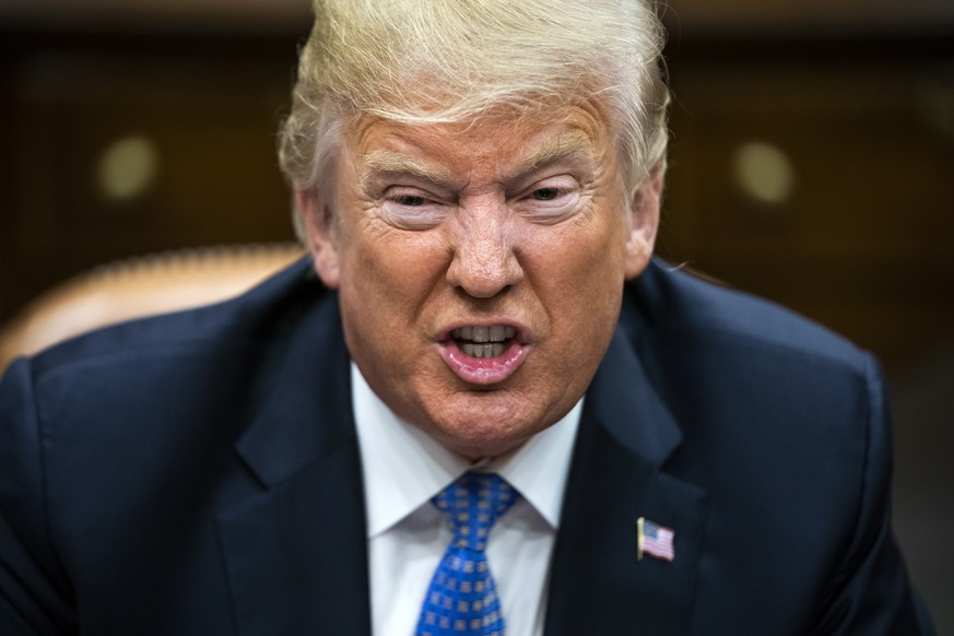 epa06966932 US President Donald J. Trump speaks with lawmakers during a roundtable discussion on the Foreign Investment Risk Review Modernization Act in the Roosevelt Room of the White House in Washin ...