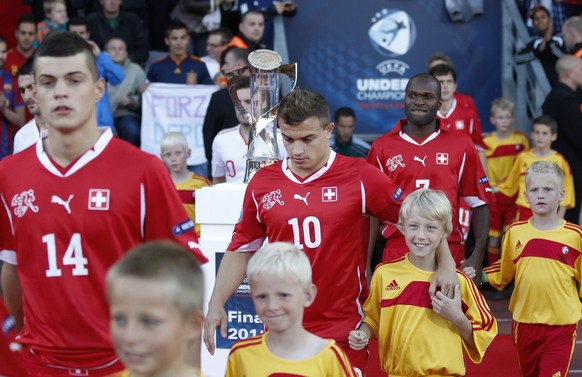 Switzerland&#039;s Granit Xhaka, Xherdan Shaqiri and Innocent Emeghara walk into the stadium prior to the UEFA Under 21 Championship final game between Switzerland and Spain at the Aarhus Stadium in A ...