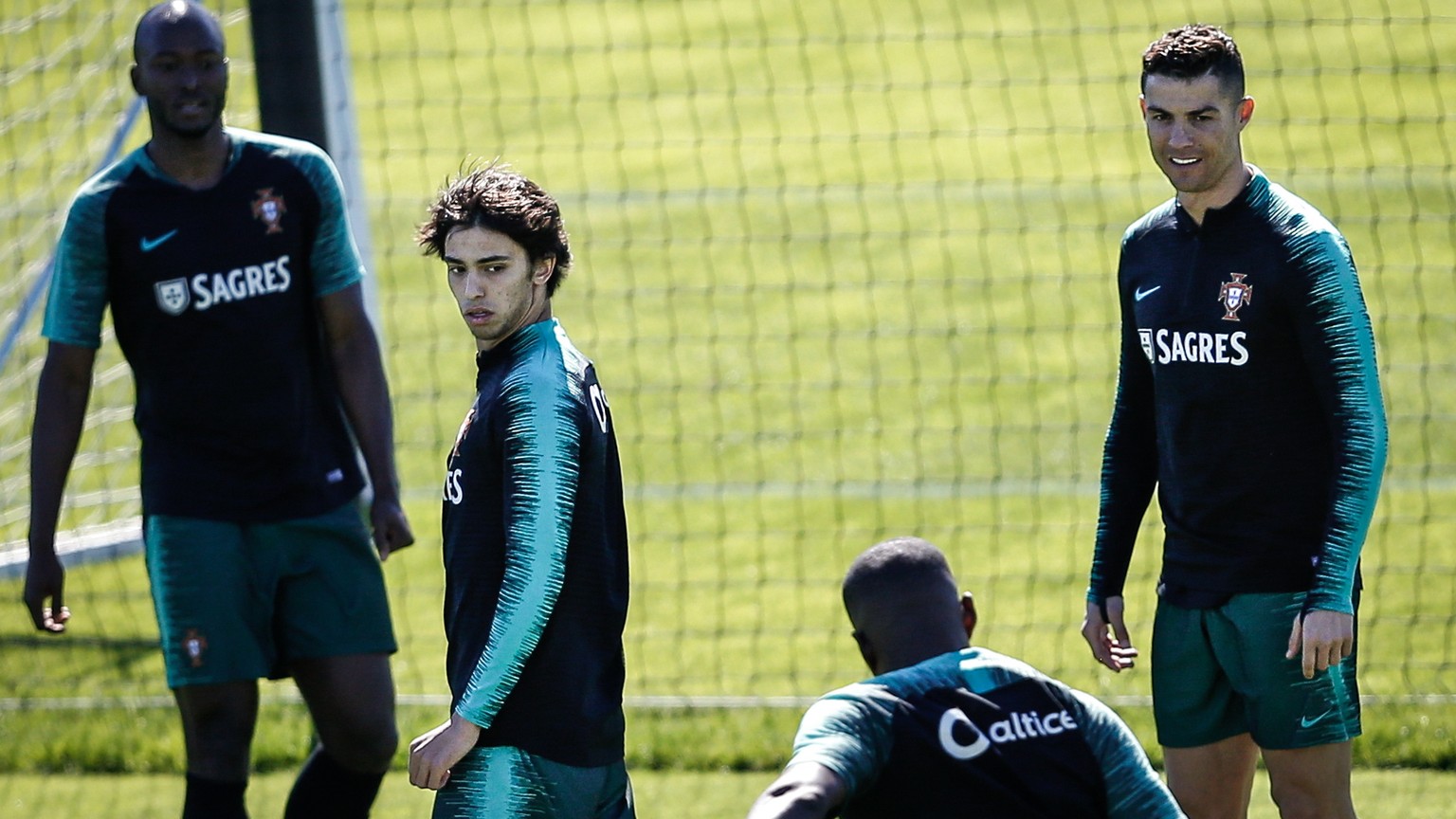 epa07450568 Portugal&#039;s player Joao Felix (2-L) and Cristiano Ronaldo (R) attend a training session at Cidade do Futebol in Oeiras, outskirts of Lisbon, Portugal, 20 March 2019. Portugal will face ...