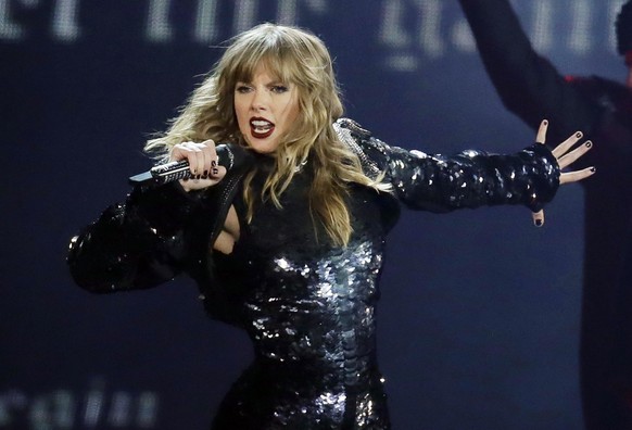 FILE - This May 8, 2018 file photo shows Taylor Swift performing during her &quot;Reputation Stadium Tour&quot; opener in Glendale, Ariz. Eric Swarbrick, 26, of Austin, Texas, has been arrested on fed ...