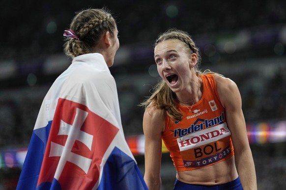 Netherlands&#039; Femke Bol celebrates winning the gold medal with bronze medalist Slovakia&#039;s Emma Zapletalova after the women&#039;s 400 meters hurdles final at the World Athletics Championships ...