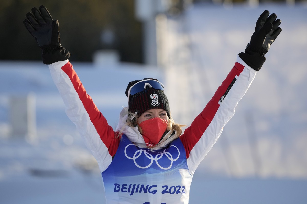 Bronze medal finisher Austria's Teresa Stadlober celebrates after the women's 7.5km + 7.5km skiathlon cross-country skiing competition at the 2022 Winter Olympics, Saturday, Feb. 5, 2022, in ...