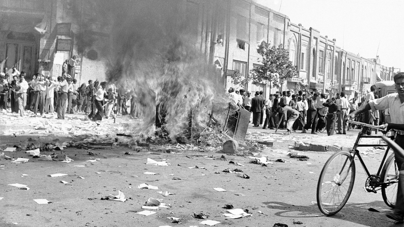 FILE -- In this August 19, 1953 file photo, office equipment of a Communist newspaper is burned in a Tehran street, during the pro-Shah riot which swept through the capital. On Tuesday, Aug. 27, 2013, ...