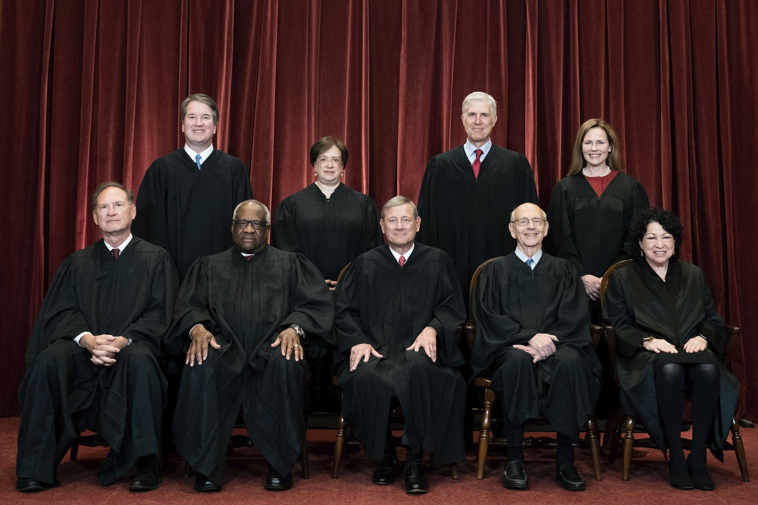FILE - Members of the Supreme Court pose for a group photo at the Supreme Court in Washington, April 23, 2021. Seated from left are Associate Justice Samuel Alito, Associate Justice Clarence Thomas, C ...