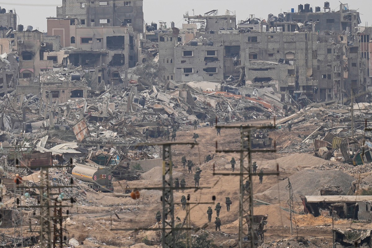 Israeli troops walk through the Gaza Strip as seen from southern Israel, Thursday, Dec. 21, 2023. (AP Photo/Ohad Zwigenberg)
Mideast-Wars-Gaza-Two Years-Photo Gallery