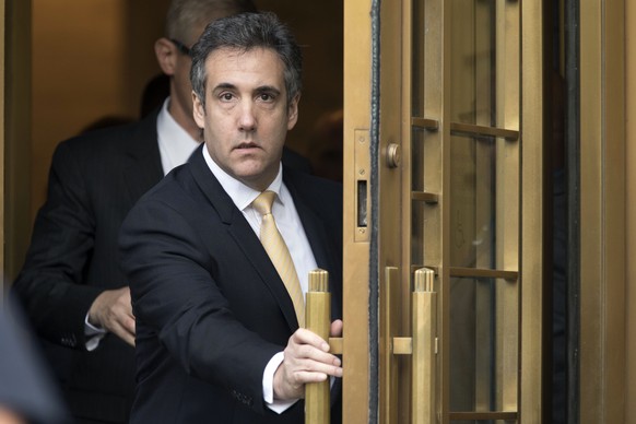 FILE - In this Aug. 21, 2018, file photo, Michael Cohen leaves federal court, in New York. More than two weeks after Donald Trump left the White House, federal prosecutors in New York have not revived ...