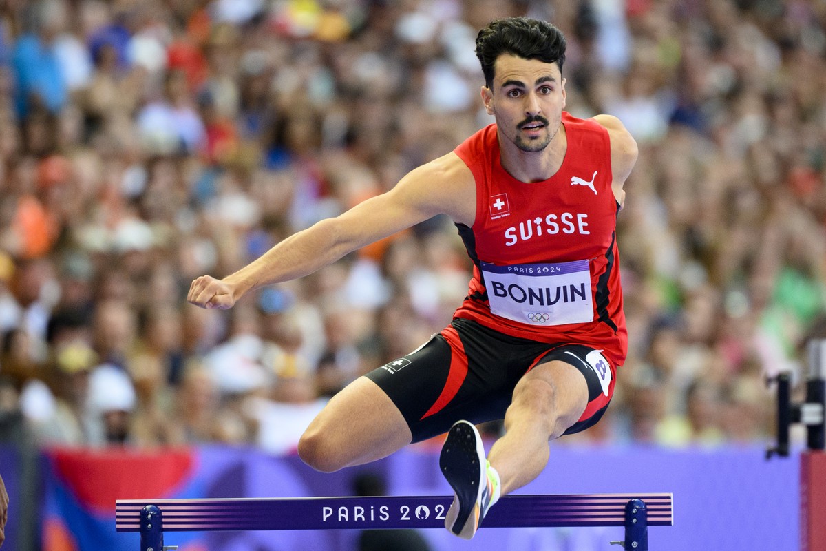 Julien Bonvin of Switzerland competes during the men's 400m Hurdles Round 1 race at the 2024 Paris Summer Olympics in Paris, France, Monday, August 5, 2024. (KEYSTONE/Laurent Gillieron)