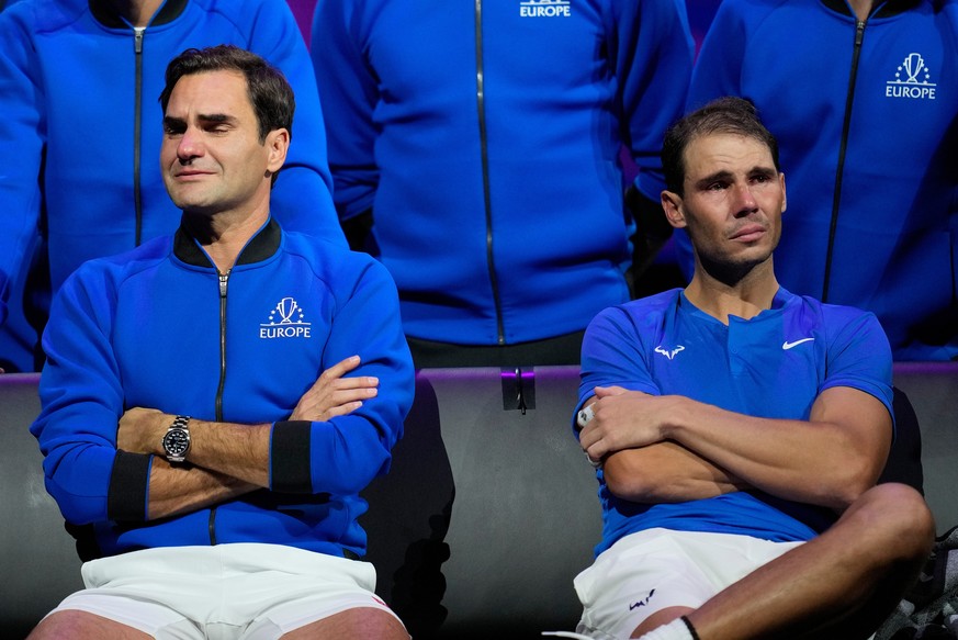 FILE - An emotional Roger Federer, left, of Team Europe sits alongside his playing partner Rafael Nadal after their Laver Cup doubles match against Team World's Jack Sock and Frances Tiafoe at th ...