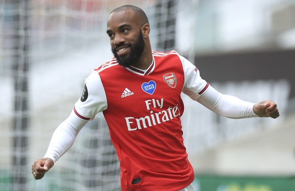 epa08527405 Alexandre Lacazette of Arsenal reacts after scoring the 2-0 lead during the English Premier League match between Wolverhampton Wanderers and Arsenal London in Wolverhampton, Britain, 04 Ju ...