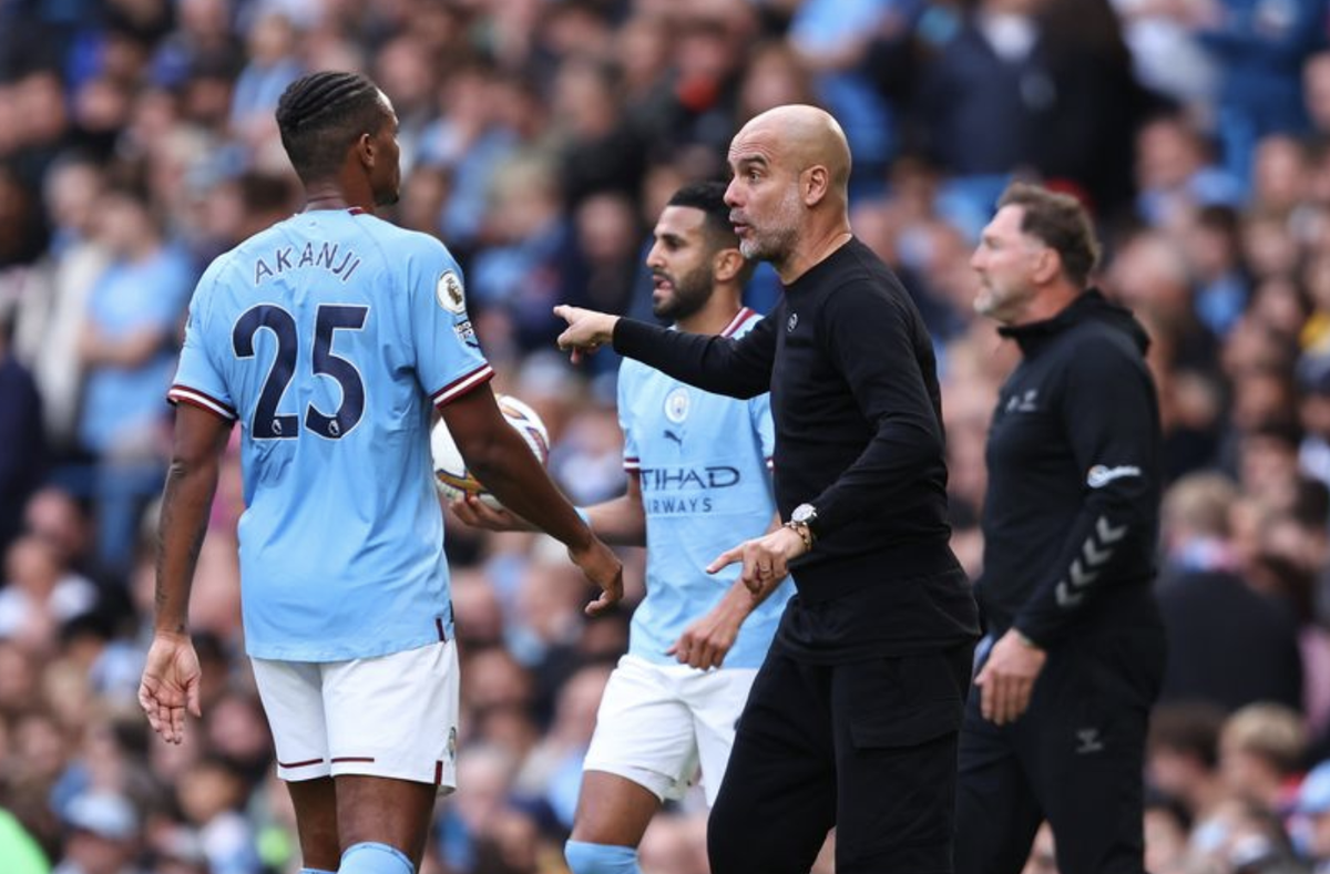 Manuel Akanji et Pep Guardiola.