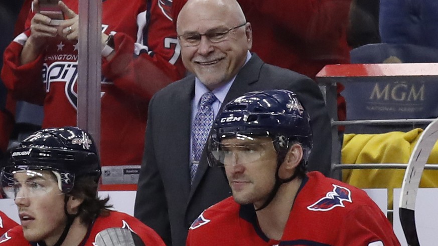 FILE - In this March 12, 2018, file photo, Washington Capitals head coach Barry Trotz smiles towards left wing Alex Ovechkin, right, after Ovechkin&#039;s goal in the second period of an NHL hockey ga ...