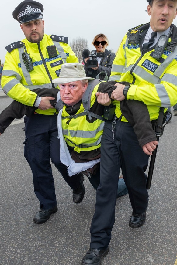 London&quot;.UK/April 162019: An Extinction Rebellion Protester getting arrested on Waterloo Bridge.