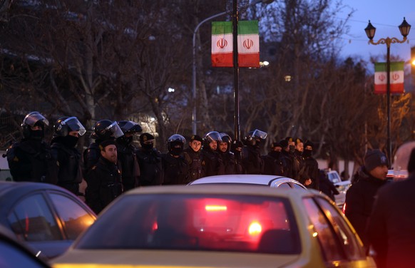 epa12649009 Iranian riot police stand guard as students protest in front of the British embassy in Tehran, Iran, 14 January 2026. Iran is experiencing a nationwide internet blackout that began on 08 J ...