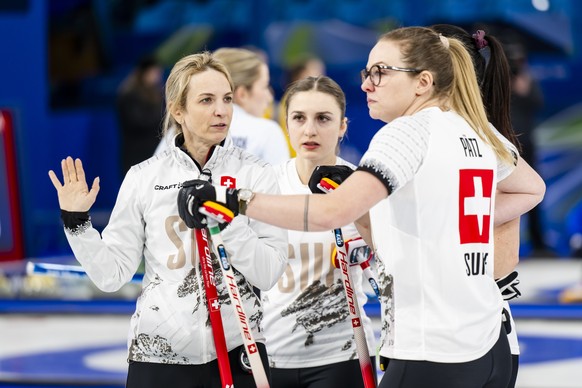 Silvana Tirinzoni, Selina Witschonke, Alina Paetz and Carole Howald, of Switzerland, from left to right, react during the women's curling round robin game between Switzerland and Canada at the 20 ...