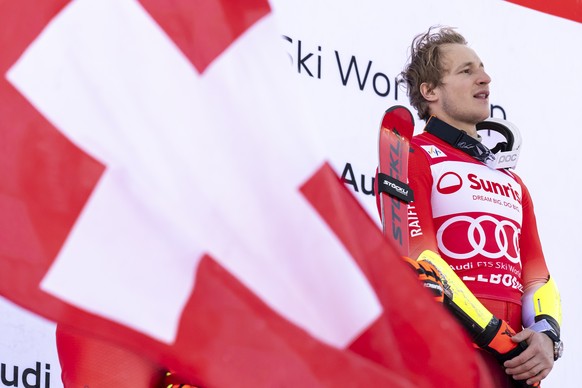 Winner Marco Odermatt of Switzerland, react on the podium after the men's Giant Slalom race at the FIS Alpine Skiing World Cup stop in Adelboden, Switzerland, 12 January 2025. (KEYSTONE/Anthony A ...