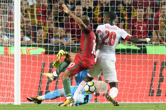 Switzerland&#039;s Johan Djourou, right, puts an own goal to 1:0 next to his goalkeeper Yann Sommer, left, and against Portugal&#039;s Joao Mario during the 2018 Fifa World Cup Russia group B qualific ...