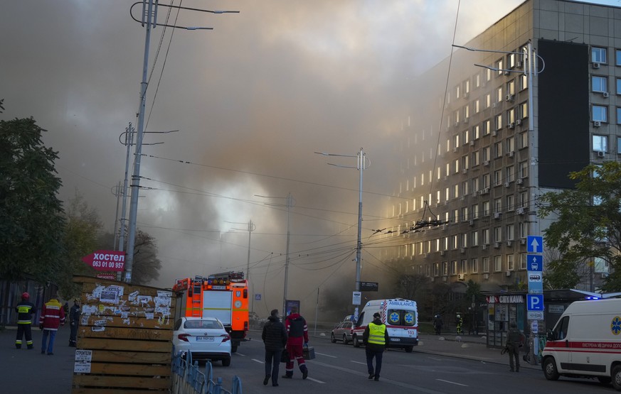 A smoke rises after a drone fired on buildings in Kyiv, Ukraine, Monday, Oct. 17, 2022. (AP Photo/Efrem Lukatsky)