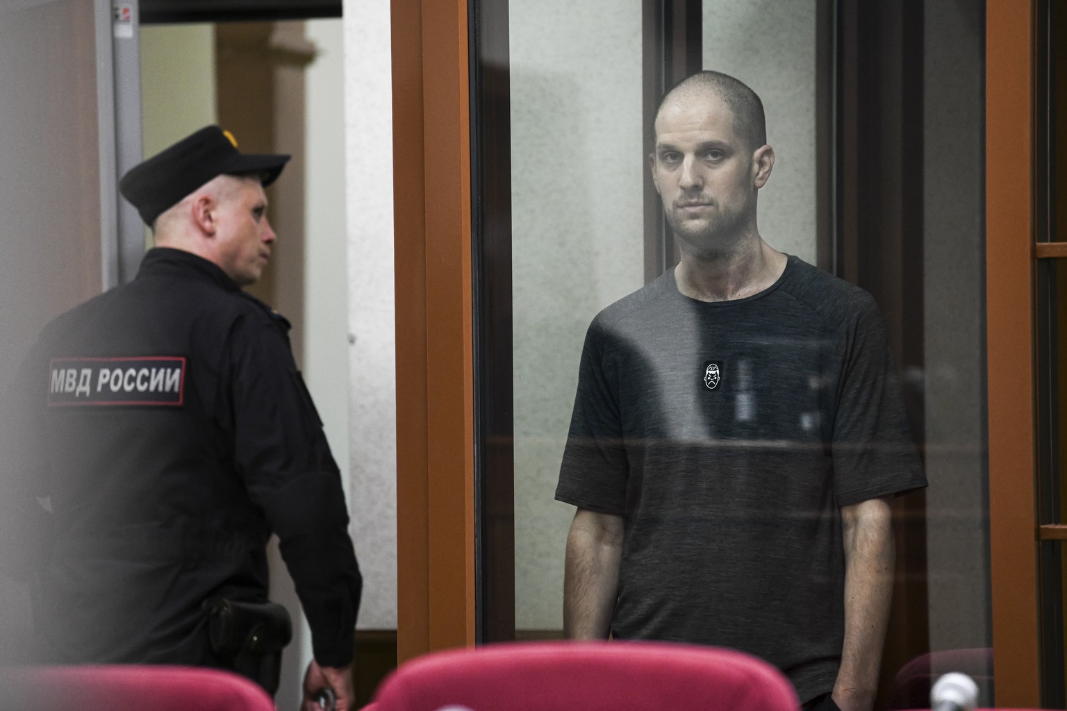 Wall Street Journal reporter Evan Gershkovich stands listening to the verdict in a glass cage of a courtroom inside the building of &quot;Palace of justice,&quot; in Yekaterinburg, Russia, on Friday,  ...