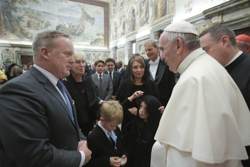 Pope Francis greets former White House press secretary Sean Spicer on the occasion of an annual meeting of the International Catholic Legislators Network, at the Vatican, Sunday, Aug. 27, 2017. Spicer ...