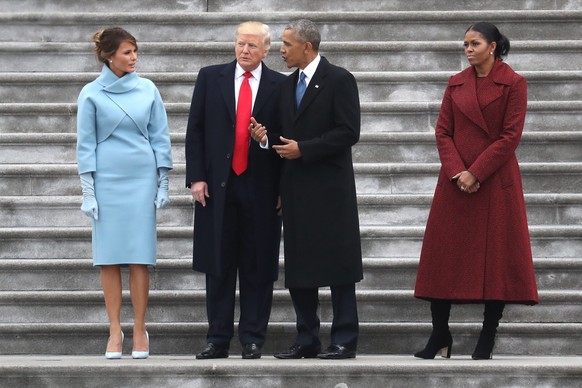 epa05735759 US President Donald J.Trump and former US president Barack Obama stand on the steps of the US Capitol with First Lady Melania Trump and Michelle Obama in Washington, DC, USA, 20 January 20 ...