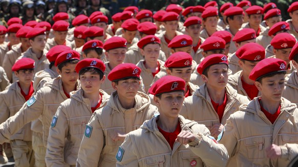 Members of Yunarmia (Young Army), an organization sponsored by the Russian military that aims to encourage patriotism among the Russian youth, march during the Victory Day Parade in the Chechnya&#039; ...