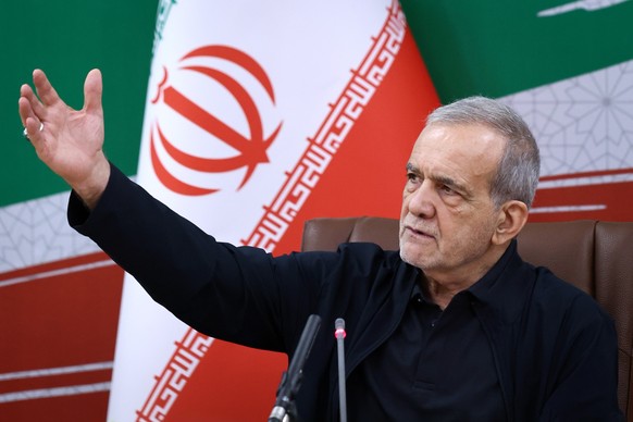 epa13156863 A handout photo made available by the Iranian Presidential Office shows Iranian President Masoud Pezeshkian attending a press conference in Tehran, Iran, 08 August 2026, on the occasion of ...