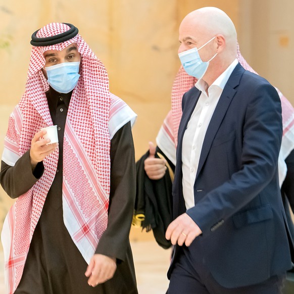 epa08922303 A handout photo made available by Saudi Ministry of Sports shows Saudi Sports Minister Prince Abdulaziz bin Turki Al Faisal (L) receiving FIFA President Gianni Infantino (R) in Riyadh, Sau ...