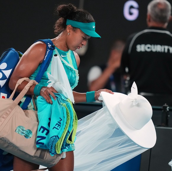 Naomi Osaka of Japan leaves the court after defeating Antonia Ruzic of Croatia in their first round match at the Australian Open tennis championship in Melbourne, Australia, Tuesday, Jan. 20, 2026. (A ...