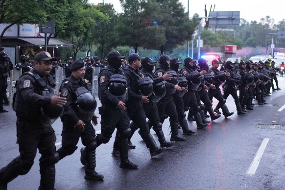 Police officers deploy outside the hotel where the England team will stay in Mexico City ahead of England's World Cup round of 16 soccer match against Mexico, Friday, July 3, 2026. (AP Photo/Edua ...