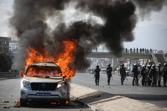 December 29, 2023, Lalipur, Nepal: View of a burning Minister s vehicle during the demonstration. Two protesters died during a demonstration by Korean Language test candidates at Balkumari, Lalitpur o ...