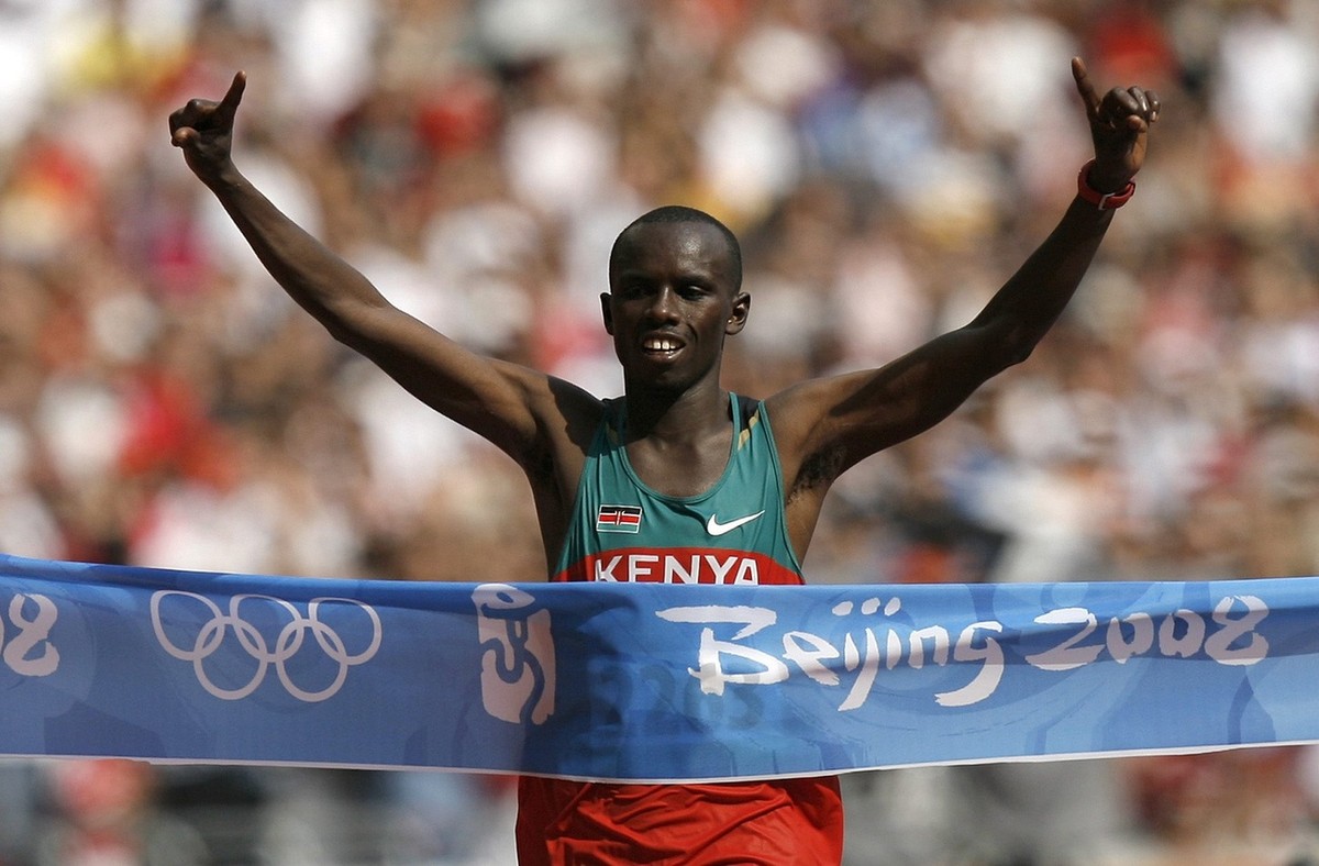 Kenyan Samuel Kamau Wansiru reacts after winning the men's marathon at the Beijing 2008 Olympics in Beijing, Sunday, Aug. 24, 2008. (KEYSTONE/Peter Klaunzer)
