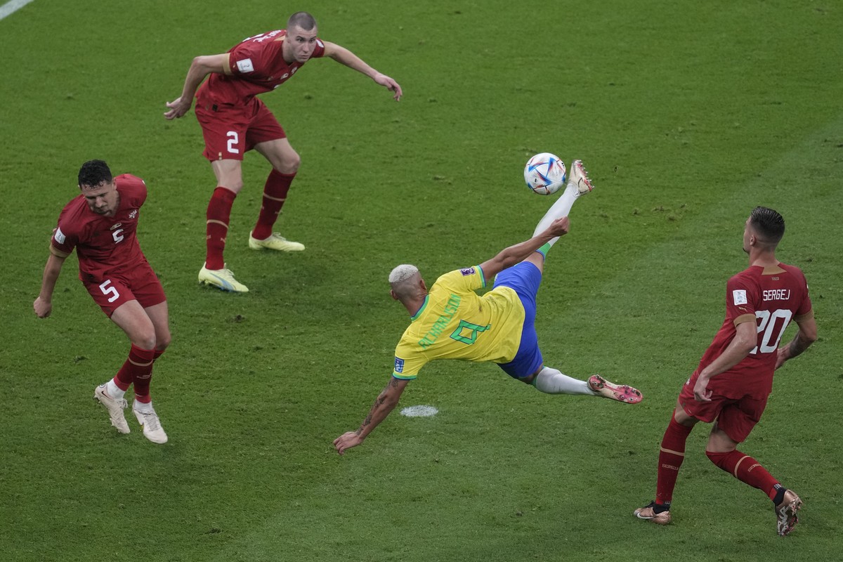 Brazil's Richarlison,second right, scores the second goal of his team against Serbia during the World Cup group G soccer match between Brazil and Serbia, at the the Lusail Stadium in Lusail, Qata ...