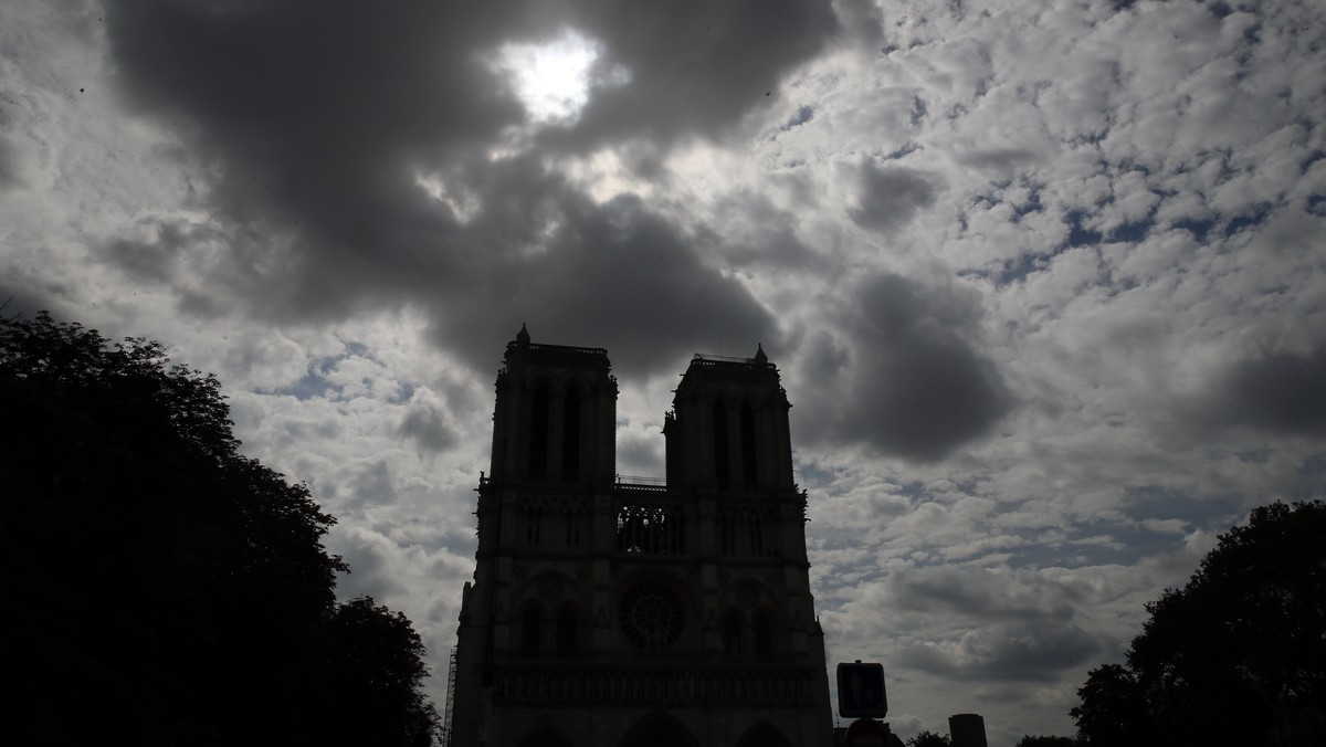 Notre Dame cathedral is silhouetted as environmental groups and unionists attend a news conference to warn against lead particles polluting the air in the area, and ask for a regularly updated chart s ...